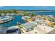 Breathtaking aerial view of waterfront homes with private boat docks on a canal leading to the bay at 10008 Spoonbill E Rd, Bradenton, FL 34209