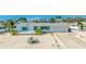 Charming single-story home with turquoise trim, well-maintained landscaping and a clean exterior at 10008 Spoonbill E Rd, Bradenton, FL 34209