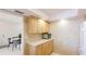 Efficiently designed kitchen with countertop space, wood cabinets, and easy access to the dining area at 10008 Spoonbill E Rd, Bradenton, FL 34209