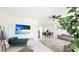 Open-concept living area with a modern decor, stylish furnishings, and plenty of natural light at 10008 Spoonbill E Rd, Bradenton, FL 34209