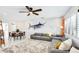 Spacious living area with stylish furniture, a decorative marlin, and an adjacent dining space at 10008 Spoonbill E Rd, Bradenton, FL 34209