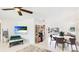 Bright, open living area with views of the water and a TV on the wall at 10008 Spoonbill E Rd, Bradenton, FL 34209