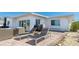 Inviting outdoor patio with lounge chairs for enjoying the waterfront lifestyle at 10008 Spoonbill E Rd, Bradenton, FL 34209
