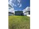 A spacious backyard with a well-manicured lawn and a white fence, offering privacy and room for outdoor activities at 10934 79Th E St, Parrish, FL 34219