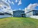 A spacious backyard with a well-manicured lawn and a white fence, offering privacy and room for outdoor activities at 10934 79Th E St, Parrish, FL 34219
