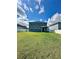 A spacious backyard with a well-manicured lawn and a white fence, offering privacy and room for outdoor activities at 10934 79Th E St, Parrish, FL 34219