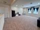 Spacious bonus room with neutral carpet, natural light, and a versatile layout for Gathering activities at 10934 79Th E St, Parrish, FL 34219
