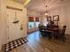 Dining room featuring rustic table, decorative lighting, and tile flooring at 10934 79Th E St, Parrish, FL 34219