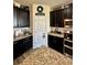 Kitchen features granite countertops, stainless steel appliances, and dark cabinets at 10934 79Th E St, Parrish, FL 34219
