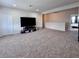 Open loft area with carpeting, perfect for a second living room or entertainment space at 10934 79Th E St, Parrish, FL 34219