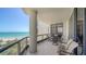 Spacious outdoor balcony with stylish seating, tile flooring, and panoramic ocean vistas at 1241 Gulf Of Mexico Dr # 603, Longboat Key, FL 34228
