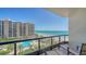 Balcony view of the pool and oceanfront with beach access from a luxury high rise condo at 1241 Gulf Of Mexico Dr # 603, Longboat Key, FL 34228