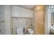 Stylish bathroom features white cabinets, a toilet, a bidet, and a glass shower with gold fixtures at 1241 Gulf Of Mexico Dr # 603, Longboat Key, FL 34228