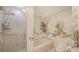 Elegant bathroom featuring a walk-in shower, a bathtub, and a toilet at 1241 Gulf Of Mexico Dr # 603, Longboat Key, FL 34228