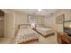 Comfortable bedroom with two twin beds, side table, lamp, and decor at 1241 Gulf Of Mexico Dr # 603, Longboat Key, FL 34228