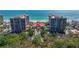 Beautiful exterior of a beachfront property with lush greenery and manicured landscaping at 1241 Gulf Of Mexico Dr # 603, Longboat Key, FL 34228
