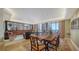 Elegant dining and living area with floor-to-ceiling windows offering stunning ocean views at 1241 Gulf Of Mexico Dr # 603, Longboat Key, FL 34228