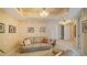 Relaxing living area with artwork, a neutral color palette, and entryways to other rooms at 1241 Gulf Of Mexico Dr # 603, Longboat Key, FL 34228