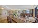 Open-concept living area features hardwood floors, custom built-ins, and expansive views at 1241 Gulf Of Mexico Dr # 603, Longboat Key, FL 34228