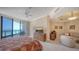 Light-filled bedroom with seating area, and a balcony overlooking a beautiful beach at 1241 Gulf Of Mexico Dr # 603, Longboat Key, FL 34228