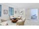 Comfortable sitting room with modern decor, including stylish chairs and artwork for relaxation at 1241 Gulf Of Mexico Dr # 603, Longboat Key, FL 34228