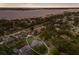 Scenic aerial shot captures a single Gathering home with pool nestled among many other homes and lush trees near the water at 1411 70Th Nw St, Bradenton, FL 34209