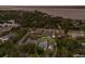 Scenic aerial shot captures a single Gathering home with pool nestled among many other homes and lush trees near the water at 1411 70Th Nw St, Bradenton, FL 34209