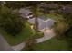 Beautiful aerial view of single Gathering home on a lush green lawn with an in-ground pool at 1411 70Th Nw St, Bradenton, FL 34209