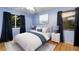 Cozy bedroom with ample natural light, neutral tones, and hardwood floors at 1411 70Th Nw St, Bradenton, FL 34209