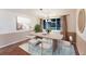 Modern dining room with sleek table, stylish chairs, and natural light at 1411 70Th Nw St, Bradenton, FL 34209