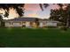 Inviting single-story home with manicured lawn, charming landscaping, and a welcoming entrance at 1411 70Th Nw St, Bradenton, FL 34209