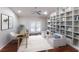 Bright office featuring custom built-ins, French doors, and modern furnishings at 1411 70Th Nw St, Bradenton, FL 34209