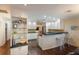 Bright, updated kitchen with white cabinetry, bar seating, and hardwood floors at 1411 70Th Nw St, Bradenton, FL 34209