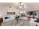 Open-concept living area with stylish furniture, natural light, and view of pool at 1411 70Th Nw St, Bradenton, FL 34209