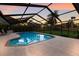 Screened-in pool with outdoor furniture offers a relaxing retreat for Gathering and friends at 1411 70Th Nw St, Bradenton, FL 34209