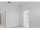 A bedroom with bright white walls and trim at 16114 Ivy Ridge Ct, Port Charlotte, FL 33953