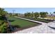 Outdoor bocce ball courts surrounded by lush landscaping, perfect for friendly competition and recreation at 16114 Ivy Ridge Ct, Port Charlotte, FL 33953