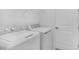 Modern laundry room with a new washer and dryer at 16114 Ivy Ridge Ct, Port Charlotte, FL 33953