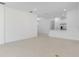 Spacious and bright living room with an open floor plan connected to the kitchen at 16114 Ivy Ridge Ct, Port Charlotte, FL 33953
