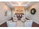 Inviting lounge area featuring a stone fireplace, cozy seating, and stylish decor for relaxation and socializing at 16114 Ivy Ridge Ct, Port Charlotte, FL 33953