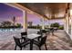 Charming outdoor patio with comfortable seating, overlooking a pool and scenic landscape, ideal for relaxation at 16114 Ivy Ridge Ct, Port Charlotte, FL 33953