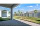 Open patio with a lush lawn at 16114 Ivy Ridge Ct, Port Charlotte, FL 33953