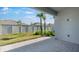Open patio with a view of the lush lawn at 16114 Ivy Ridge Ct, Port Charlotte, FL 33953