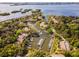 Aerial view of a waterfront community with a marina filled with boats and yachts at 1711 Pelican Cove Rd # 443, Sarasota, FL 34231