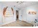 Hallway featuring light wood-look flooring leading to bedrooms and bathrooms at 1711 Pelican Cove Rd # 443, Sarasota, FL 34231
