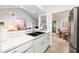 Bright, modern kitchen with white cabinets and an open view into the living area, perfect for entertaining at 1711 Pelican Cove Rd # 443, Sarasota, FL 34231