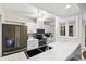 Updated kitchen with stainless steel appliances, sleek countertops, and ample cabinet space at 1711 Pelican Cove Rd # 443, Sarasota, FL 34231