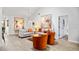 Bright living room with high ceilings, neutral walls, and modern decor with cozy seating at 1711 Pelican Cove Rd # 443, Sarasota, FL 34231