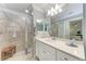 Bathroom with walk-in shower having a palm tree etched on the glass at 17520 Gawthrop Dr # 103, Bradenton, FL 34211