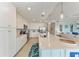Spacious kitchen with white cabinets, stainless steel appliances, a large center island, and an open layout at 17520 Gawthrop Dr # 103, Bradenton, FL 34211
